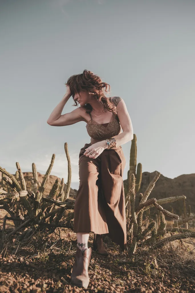 Rust knit top styled in high desert scrub