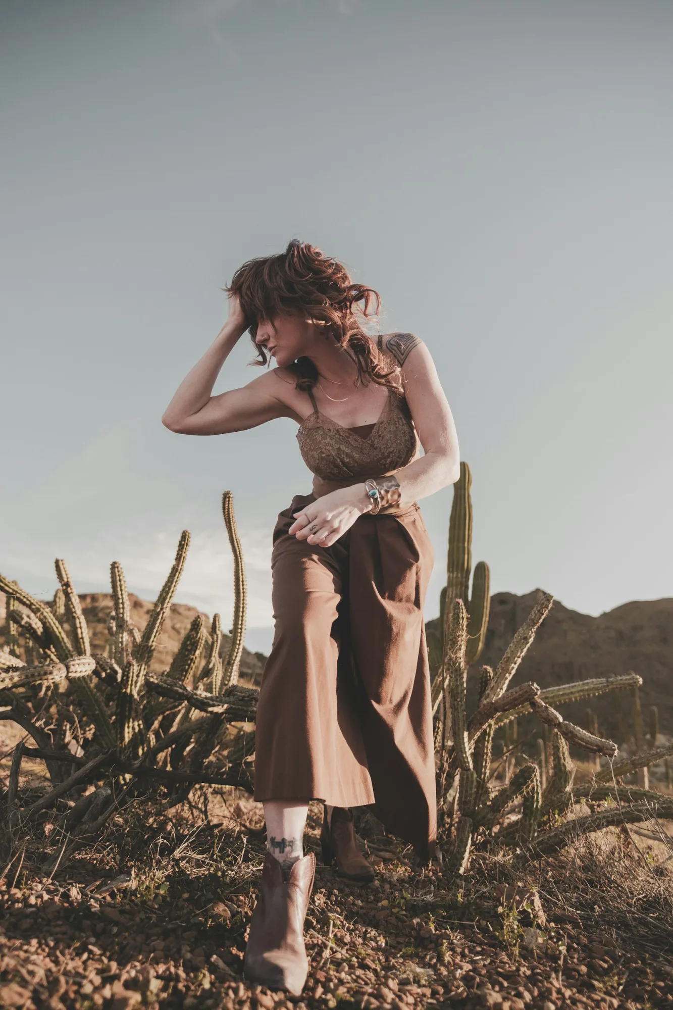 Rust knit top styled in high desert scrub