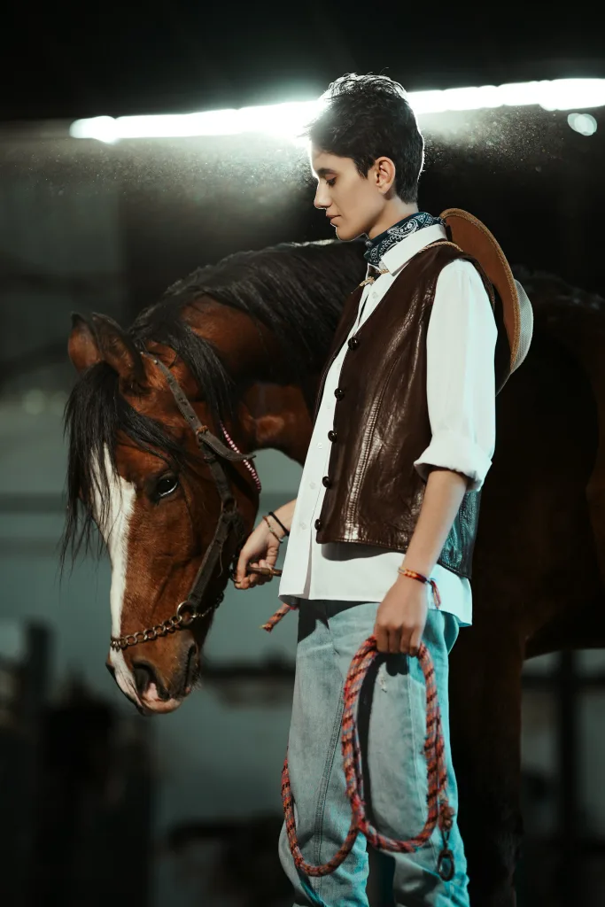 Brown suede western vest over a white shirt, stable light