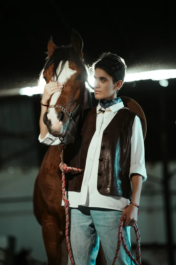 Suede western vest, leading a paint horse