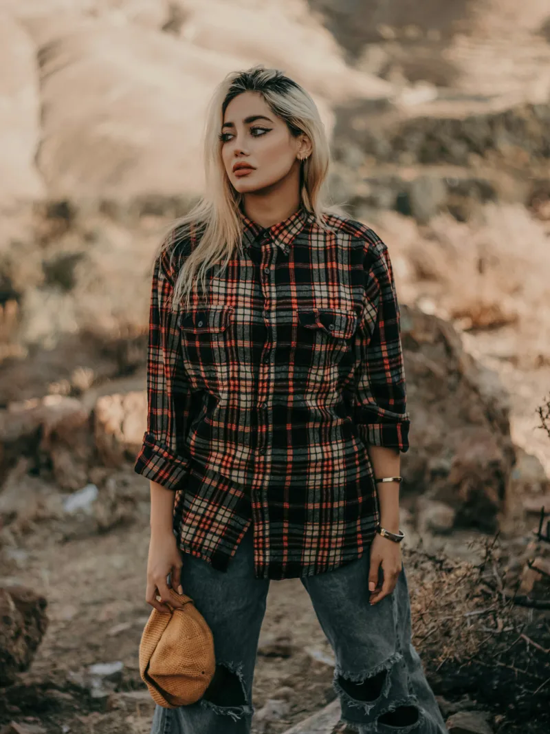 Oversized plaid flannel with distressed denim in the desert