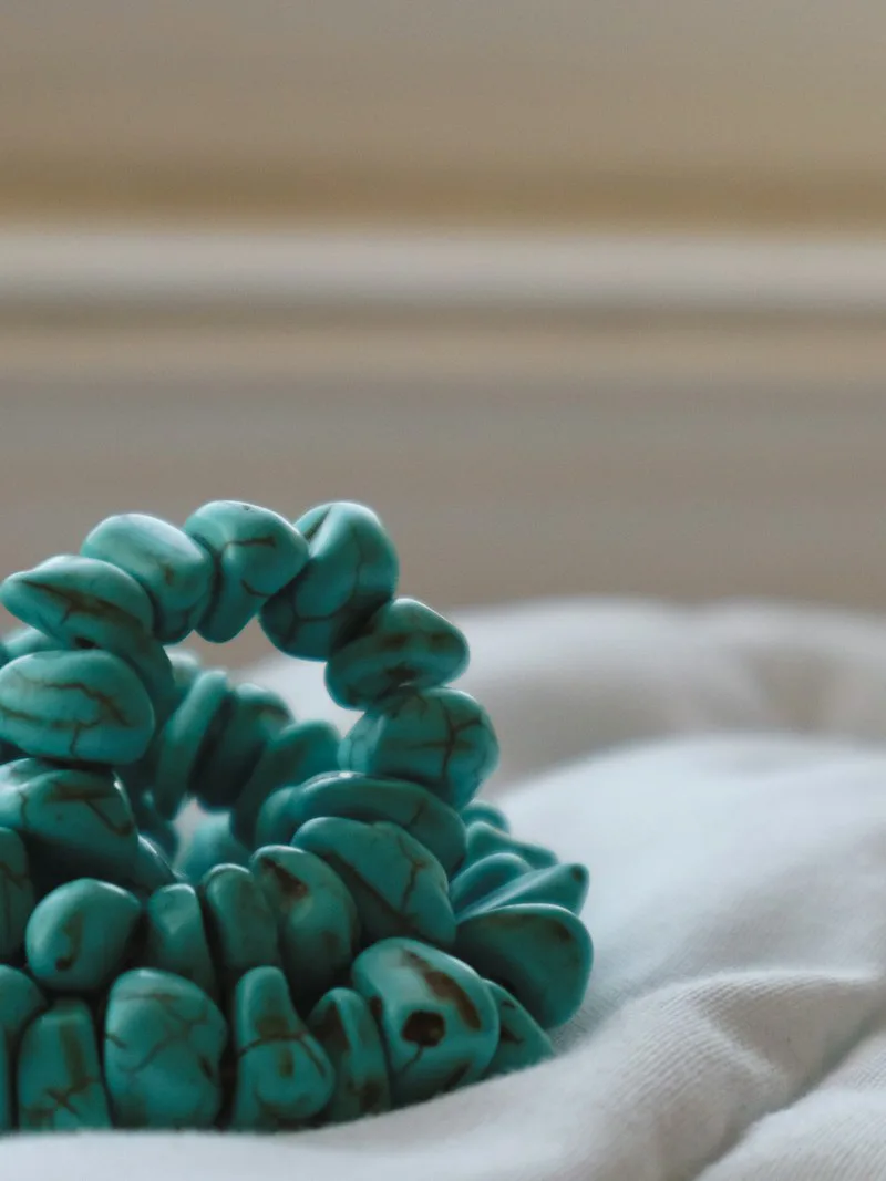 Turquoise necklace detail with brown heishi beads